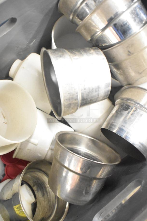 Assorted lot featuring mixing cup collars and fluorescent sockets, showcasing varying materials and conditions, bundled together.