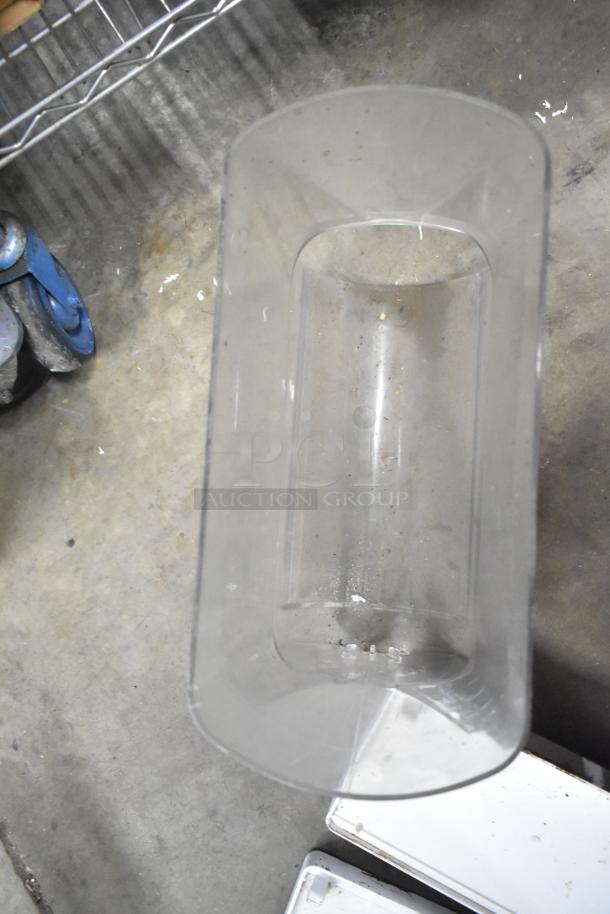 Clear plastic slushie machine hopper, used condition, visible dirt. Part of a lot with range grates, and Turbochef kickplates.