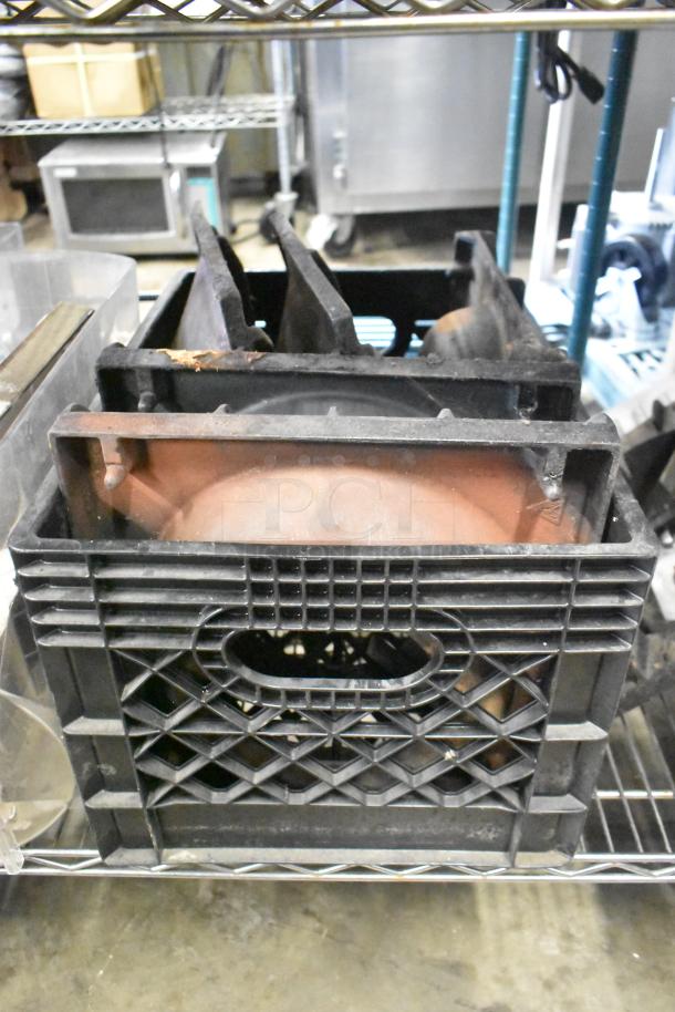 Crated range grates and metal components; includes slushie machine hopper and Turbochef kickplates; various conditions.