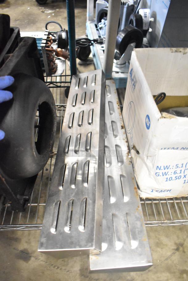 Tier lot of items including range grates, slushie machine hopper, and Turbochef kickplates. Visible wear on metal parts.