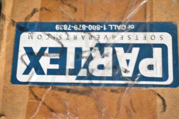 Alt text: Box labeled "Partex Softserve Parts" for auction, includes range grates, slushie machine hopper, Turbochef kickplates.