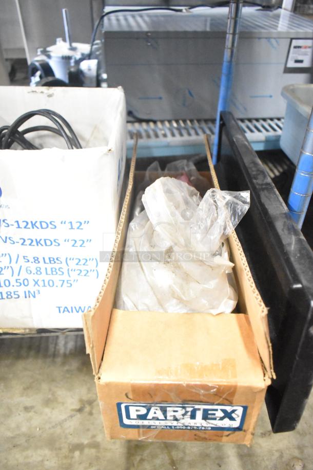 Tiered lot of various kitchen items including range grates, slushie machine hopper, Turbochef kickplates, in used condition.