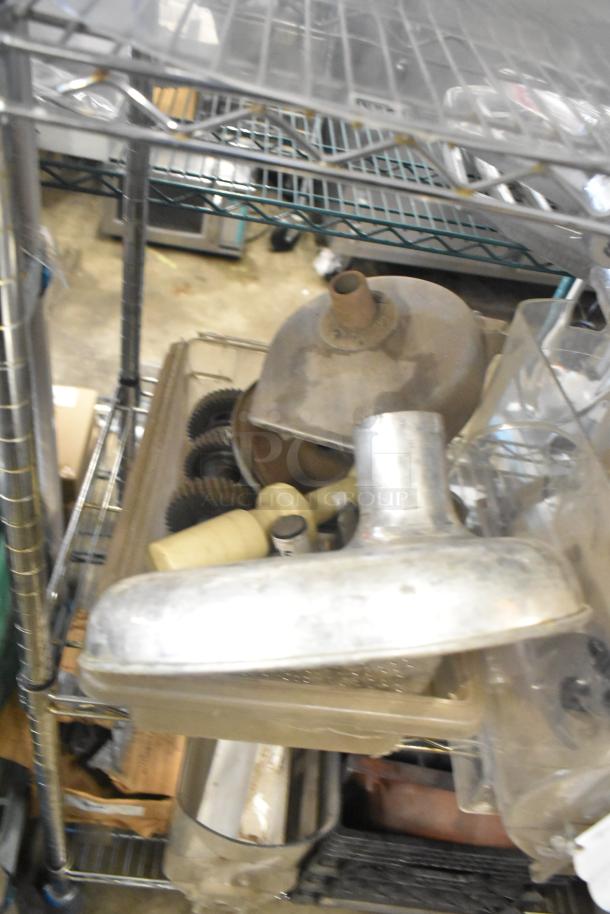 Lot including slushie machine hoppers, metal panels, meat grinder tray, Pelican head grating blade; mixed condition.