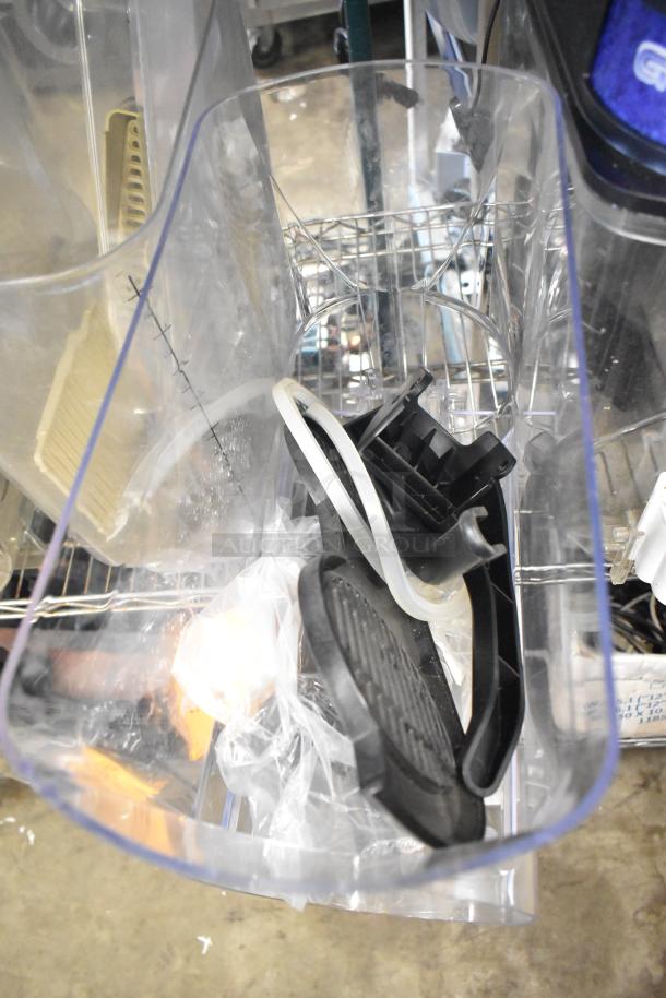 Tier lot featuring slushie machine hoppers, metal panels, meat grinder tray, and a Pelican head grating blade in mixed condition.