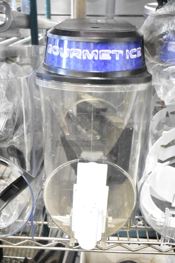 Slushie machine hopper with "GOURMET ICE" label, clear plastic, attached to a metal panel, good condition.