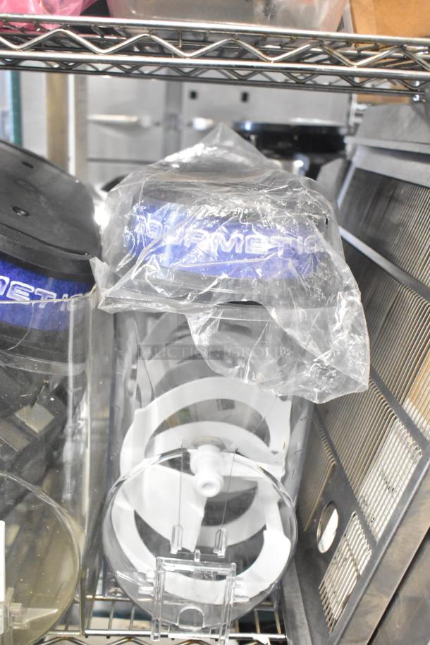 Auction lot including slushie machine hoppers, metal panels, meat grinder tray, and pelican head grating blade. Various conditions.