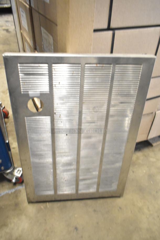 Metal panel with vertical grooves, features a circular cutout, used, part of tier lot with varied items.
