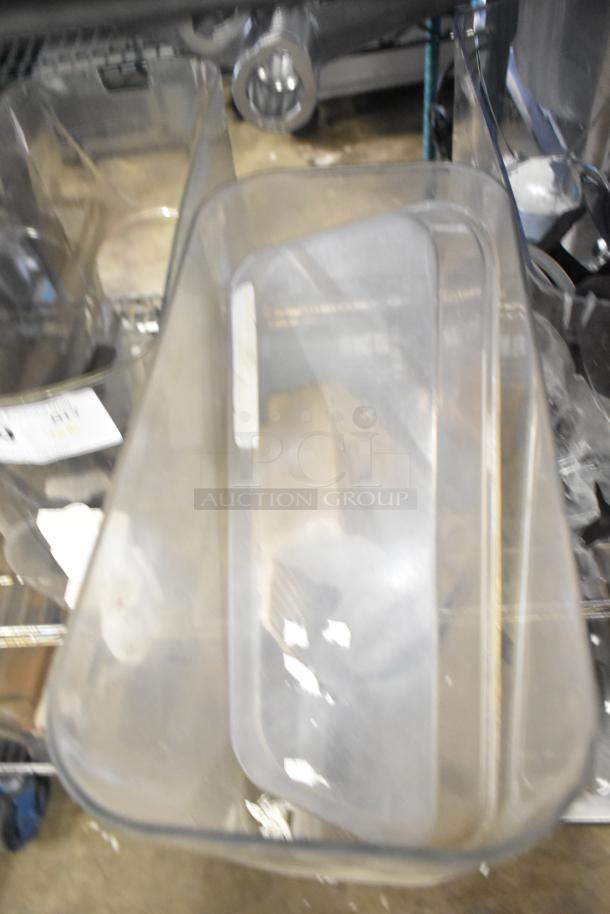 Tier lot including slushie machine hoppers, metal panels, meat grinder tray, and Pelican head grating blade. Mixed condition.