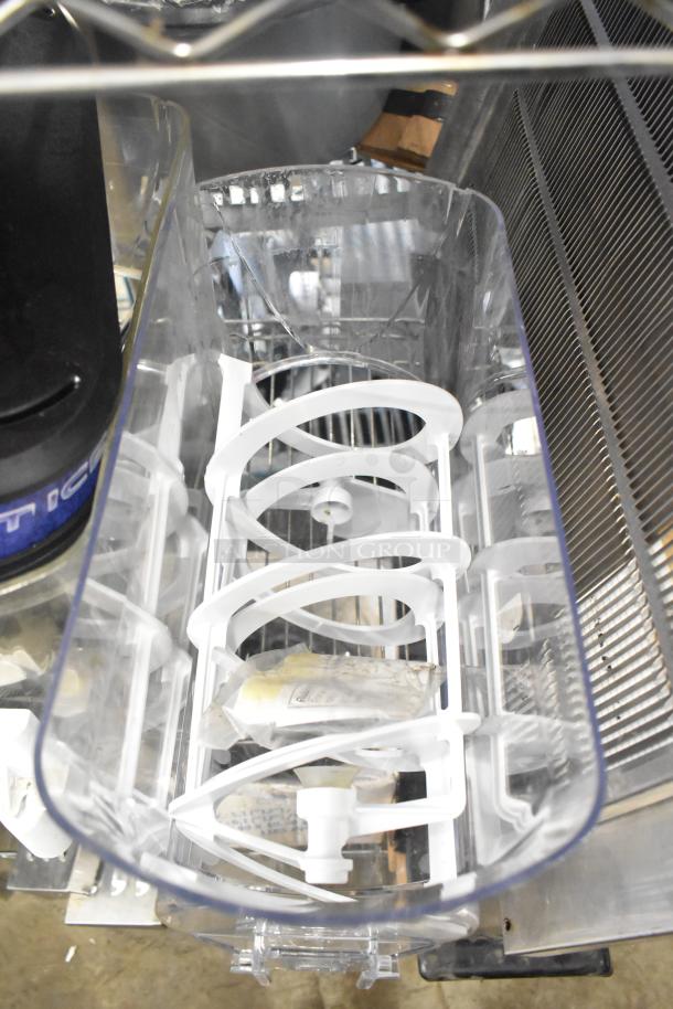 Clear slushie machine hopper with white plastic interior components. Used condition with visible wear.