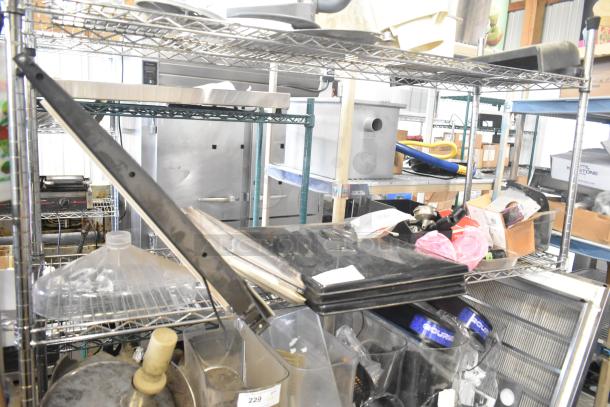 Auction lot with ice cream machine lids, ice head panel, H-600 switch kit, portafilters, filter drier, ballast, dispenser spouts.