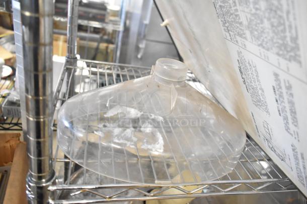 ALL ONE MONEY! tier lot includes ice cream machine lids, Ice Head panel, switch kit for H-600, portafilters, Danfoss filter drier, ballast, and Bunn dispenser spouts. Visible shelf condition.