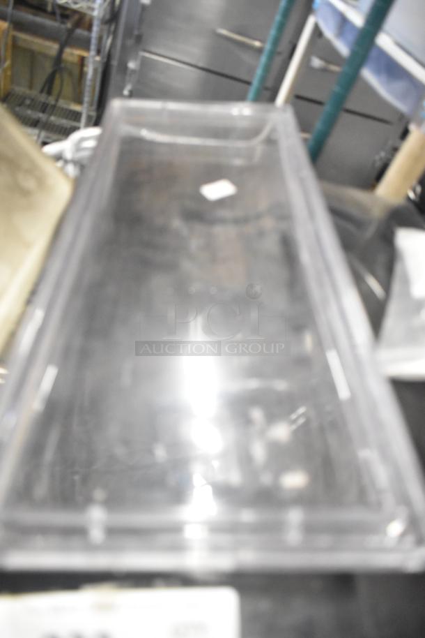 Assorted lot including ice cream machine lids, Ice Head Panel, H-600 switch kit, portafilters, and Bunn dispenser spouts.