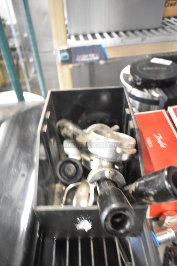 Assorted auction lot including ice cream machine lids, Ice Head Panel, H-600 switch kit, portafilters, Danfoss filter drier.