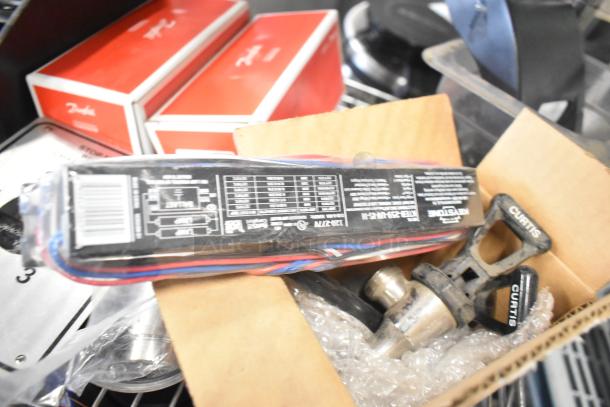 Tier lot of various items including Curtis portafilters, Danfoss filter drier, and Bunn dispenser spouts.