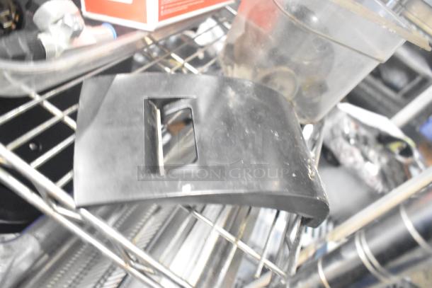 Tiered lot including ice cream machine lids, ice head panel, switch kit for H-600, portafilters, filter drier, spouts.