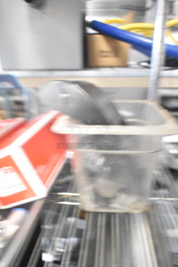 Tier lot of mixed items including ice cream machine lids, ice head panel, switch kit for H-600, Bunn spouts, and more.