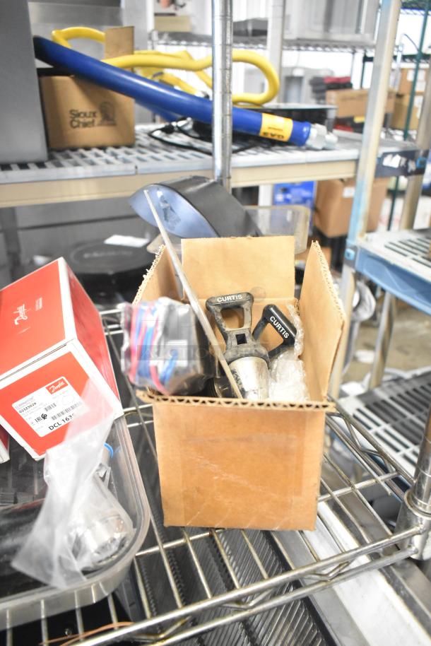 Tier lot including ice cream machine lids, Ice Head panel, H-600 switch kit, Curtis portafilters, Danfoss filter drier, ballast.