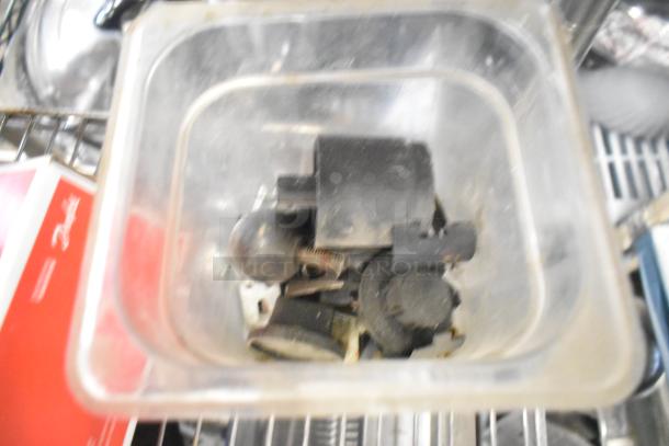 Tiered lot of various items including ice cream machine lids, Ice Head Panel, Danfoss filter drier, and more. Used condition.