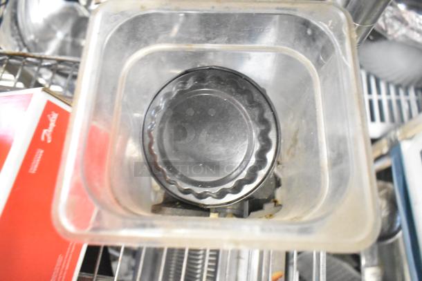 Assorted equipment lot including ice cream machine lids, Danfoss filter drier, and switch kit. Items for repair or parts use.