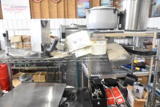 Auction lot featuring Pelican Head Blade, food processor grating/slicing blades, and meat slicer carriage. Item 231 tagged.