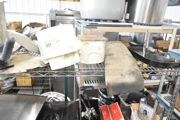 Tier lot including Pelican head blade, food processor grating/slicing blades, and meat slicer carriage on metal shelf.