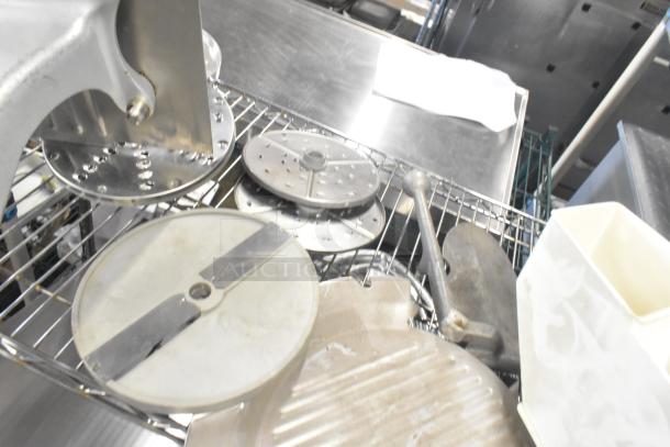 Lot of kitchen tools: Pelican head blade, food processor blades, meat slicer carriage. Mixed condition, stainless steel parts.