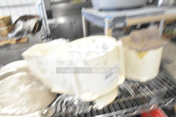 Auction lot includes Pelican head blade, food processor blades, and meat slicer carriage; some wear visible.