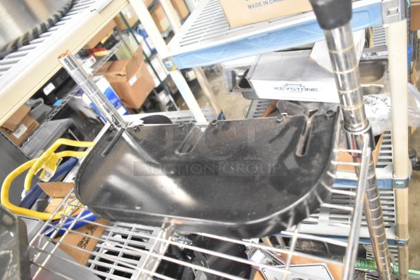 Alt Text: Assorted kitchen equipment lot with Pelican Head Blade, food processor blades, and meat slicer carriage on metal shelves.