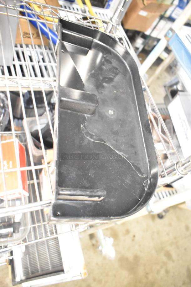 Alt text: Auction image showing a Pelican Head Blade on a metal shelf. Part of a tier lot including various kitchen items.