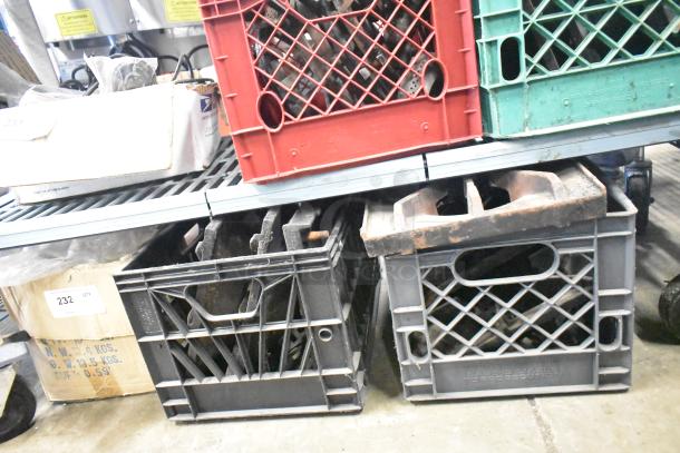 Nine metal range grates in used condition, stored in crates. Ideal for range replacement or repair.