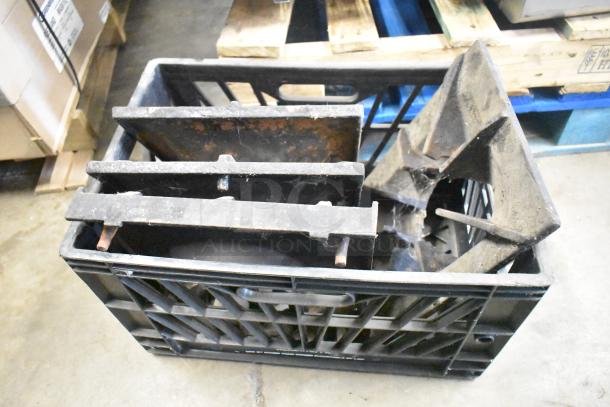 9 metal range grates, used, in black crate. Grates show wear and rust. Auction for 9 times your bid.