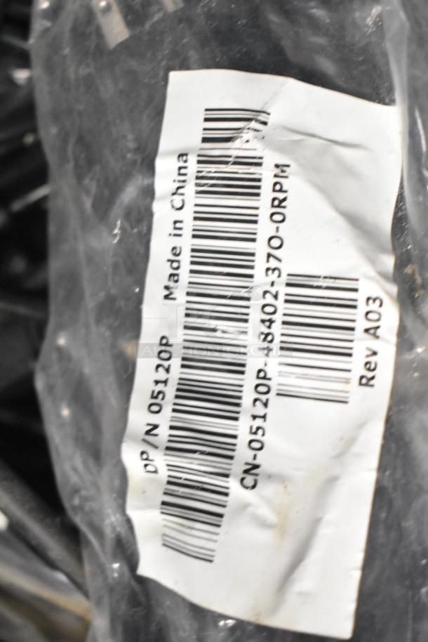 ALL ONE MONEY! Lot with range burners, range grates, and wires. Label reads "Made in China". Model CN-05120P-43402-370-0RPM.