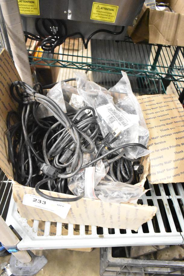 Box of assorted items including range burners, grates, and wires; labeled as "ALL ONE MONEY!" tier lot. Condition varies.