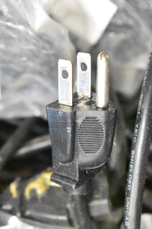 Tier lot including range burners, grates, and wires. Close-up of a three-pronged plug and surrounding wires. Fair condition.