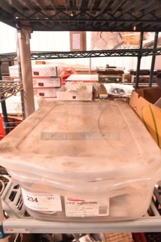 Plastic storage bin containing a mixed lot of Taylor ice cream machine parts and carbonated beverage machine adapters. Label reads "Clear Impressions."