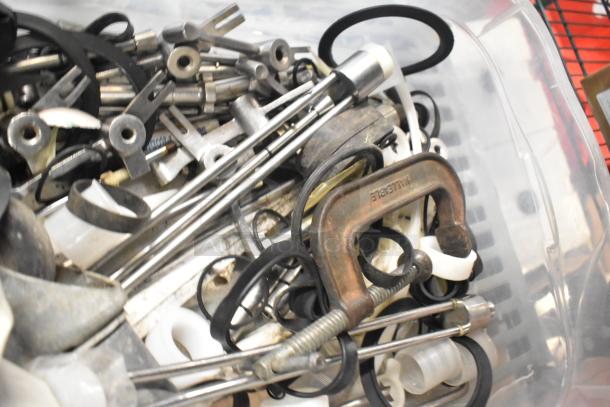 Variety of parts for Taylor ice cream machines and carbonated beverage adapters, mixed condition, in a plastic bin.