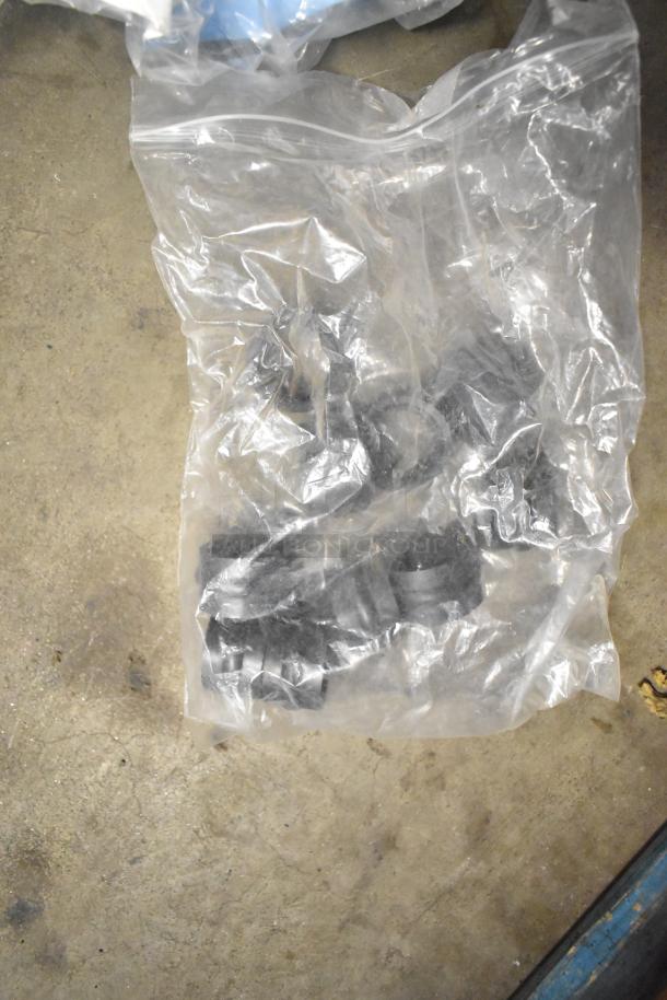 Bag of Taylor ice cream machine parts and carbonated beverage machine adapters, used condition.