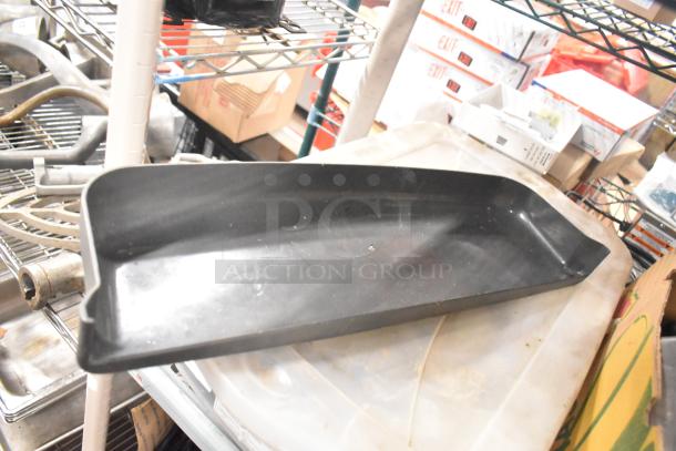 Tier lot of various machine parts, including Taylor ice cream machine components, with adapters on metal shelving. Mixed condition.