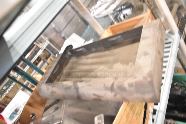 Tier lot of assorted items including Taylor ice cream machine parts and carbonated beverage machine adapters in used condition.