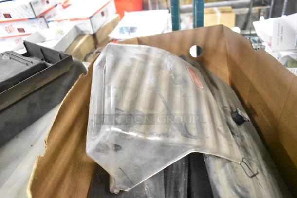 Tier lot of various items including Taylor ice cream machine parts and carbonated beverage machine adapters in used condition.