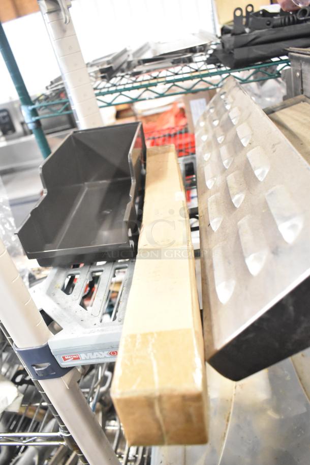 Tiered lot including Turbochef kickplate, Taylor ice cream machine drip tray, and carbonated beverage machine drip tray.