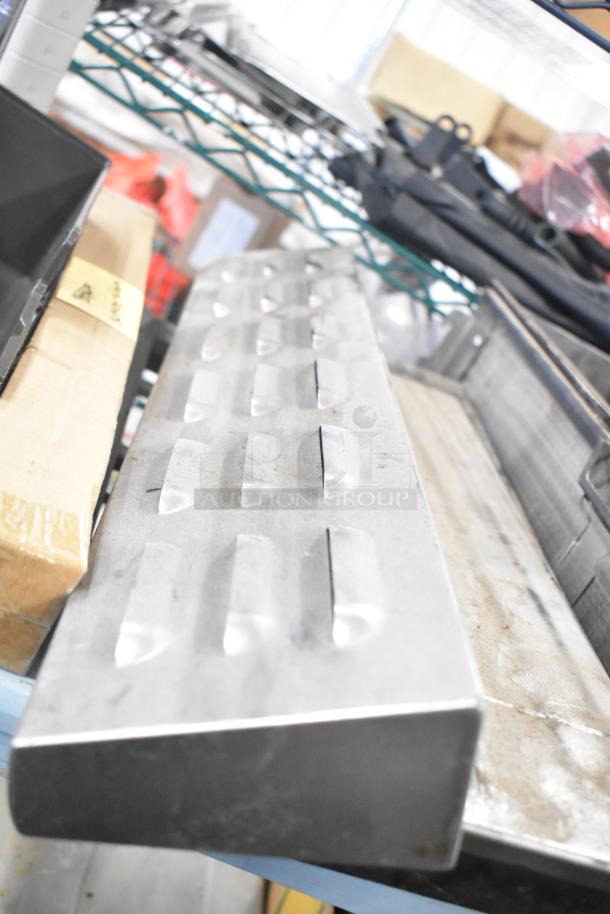 Tier lot with various items, including a Turbochef kickplate and Taylor ice cream machine drip tray. Used condition.