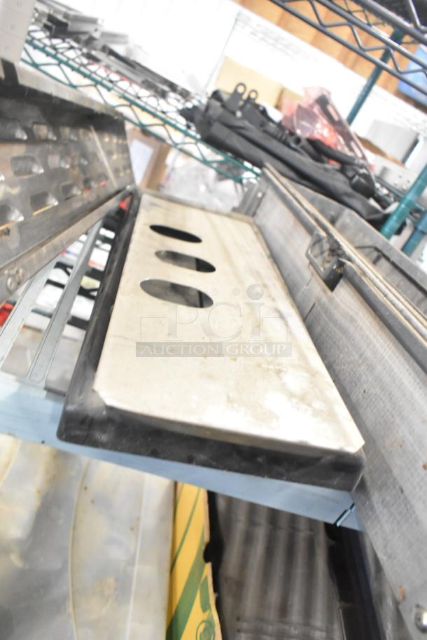 Mixed lot of industrial components including a Turbochef kickplate and Taylor ice cream machine drip tray. Items on shelf.