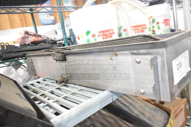 Tier lot including Turbochef kickplate, Taylor ice cream machine drip tray, and carbonated beverage machine drip tray. Item 238.