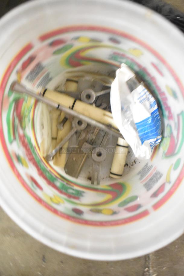 Tier lot of various items in a colorful bucket, includes Turbochef kickplate, Taylor ice cream machine drip tray parts.