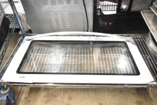 Convection oven replacement door with glass panel, white frame, and metal handle in new condition, labeled "236" on the corner.