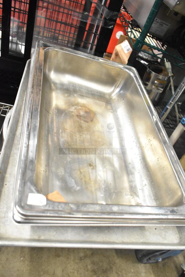 12 metal baking pans, stainless steel, visible wear and marks, suitable for commercial use, sold as set.