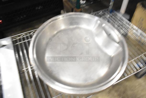 Metal baking pan, stainless steel, round shape, slightly used, stored on metal rack, auction includes 12 various items.