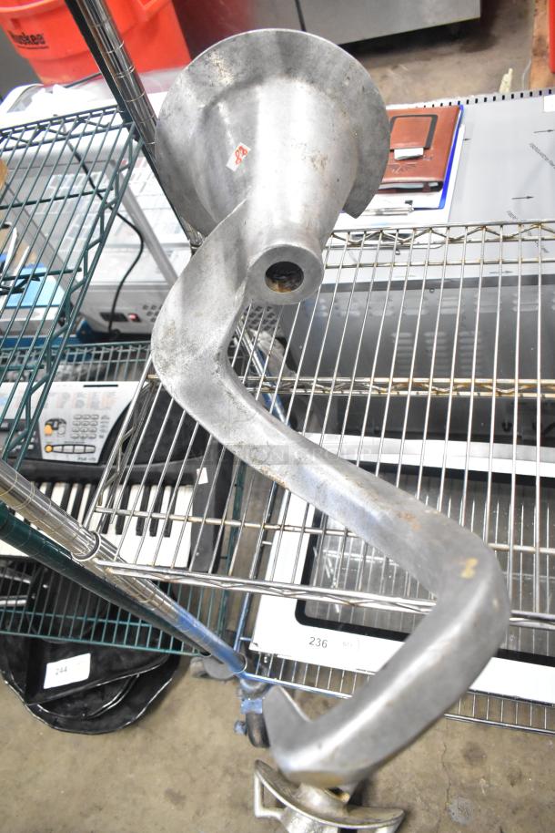 Metal dough hook attachment for Hobart mixer, used condition. Part of a 15-piece assorted lot including paddles and whisks.