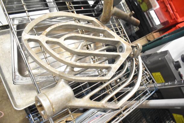15 Hobart Mixer attachments, including dough hooks, paddle whips, and whisk. Used condition, metal material.